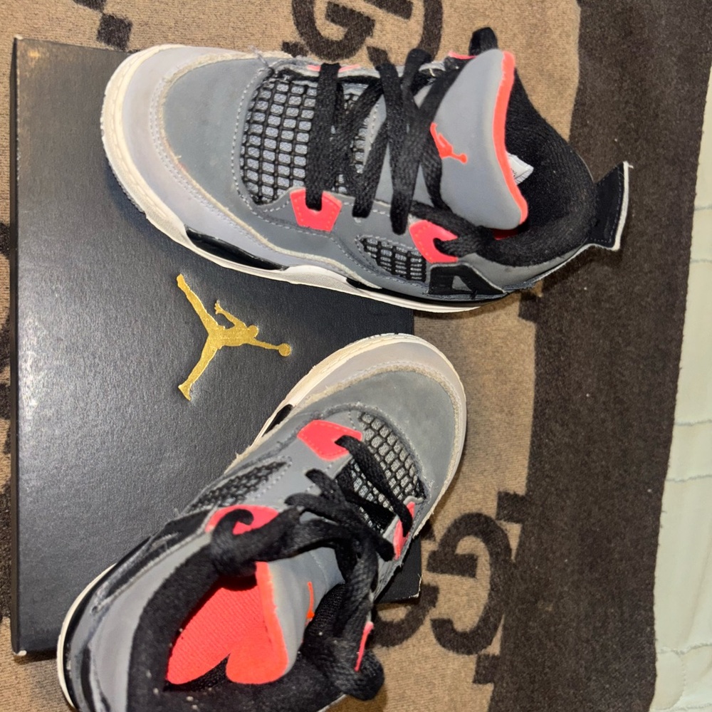 Gray and Black Sneakers with Red Accents